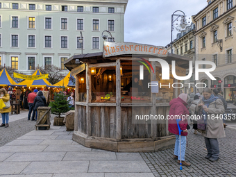 Visitors experience the festive atmosphere of the Medieval Christmas Market in Munich, Bavaria, Germany, on December 6, 2024. The market, lo...