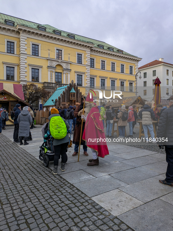 Visitors experience the festive atmosphere of the Medieval Christmas Market in Munich, Bavaria, Germany, on December 6, 2024. The market, lo...