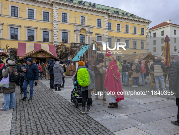 Visitors experience the festive atmosphere of the Medieval Christmas Market in Munich, Bavaria, Germany, on December 6, 2024. The market, lo...