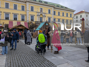 Visitors experience the festive atmosphere of the Medieval Christmas Market in Munich, Bavaria, Germany, on December 6, 2024. The market, lo...