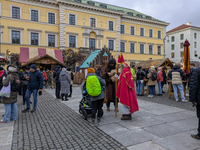 Visitors experience the festive atmosphere of the Medieval Christmas Market in Munich, Bavaria, Germany, on December 6, 2024. The market, lo...