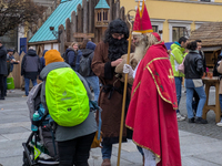 Visitors experience the festive atmosphere of the Medieval Christmas Market in Munich, Bavaria, Germany, on December 6, 2024. The market, lo...