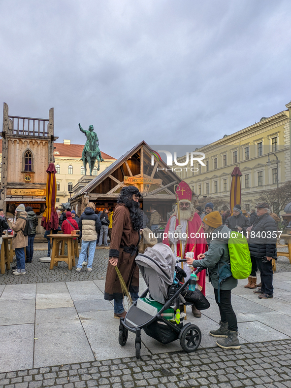 Visitors experience the festive atmosphere of the Medieval Christmas Market in Munich, Bavaria, Germany, on December 6, 2024. The market, lo...