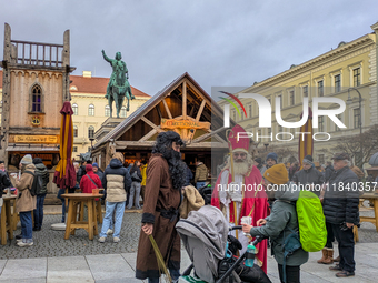 Visitors experience the festive atmosphere of the Medieval Christmas Market in Munich, Bavaria, Germany, on December 6, 2024. The market, lo...