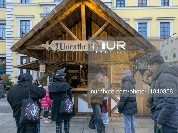 Visitors experience the festive atmosphere of the Medieval Christmas Market in Munich, Bavaria, Germany, on December 6, 2024. The market, lo...