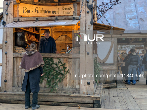 Visitors experience the festive atmosphere of the Medieval Christmas Market in Munich, Bavaria, Germany, on December 6, 2024. The market, lo...