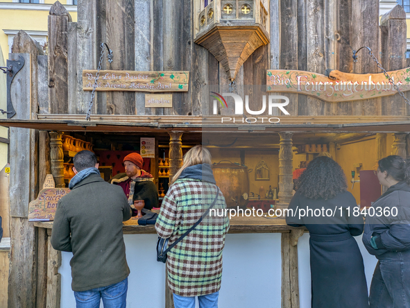 Visitors experience the festive atmosphere of the Medieval Christmas Market in Munich, Bavaria, Germany, on December 6, 2024. The market, lo...