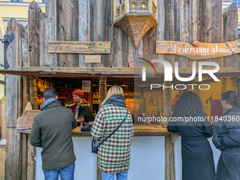 Visitors experience the festive atmosphere of the Medieval Christmas Market in Munich, Bavaria, Germany, on December 6, 2024. The market, lo...