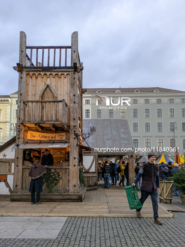 Visitors experience the festive atmosphere of the Medieval Christmas Market in Munich, Bavaria, Germany, on December 6, 2024. The market, lo...