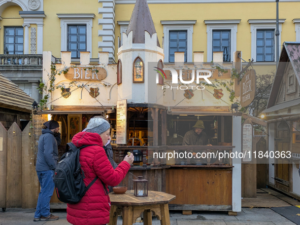 Visitors experience the festive atmosphere of the Medieval Christmas Market in Munich, Bavaria, Germany, on December 6, 2024. The market, lo...