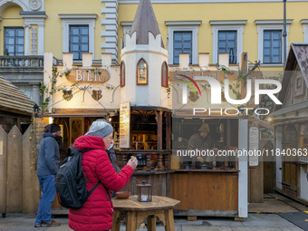 Visitors experience the festive atmosphere of the Medieval Christmas Market in Munich, Bavaria, Germany, on December 6, 2024. The market, lo...