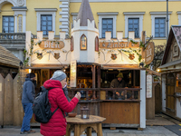 Visitors experience the festive atmosphere of the Medieval Christmas Market in Munich, Bavaria, Germany, on December 6, 2024. The market, lo...