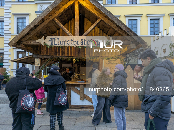 Visitors experience the festive atmosphere of the Medieval Christmas Market in Munich, Bavaria, Germany, on December 6, 2024. The market, lo...