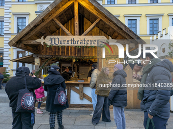 Visitors experience the festive atmosphere of the Medieval Christmas Market in Munich, Bavaria, Germany, on December 6, 2024. The market, lo...