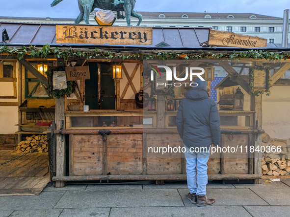 Visitors experience the festive atmosphere of the Medieval Christmas Market in Munich, Bavaria, Germany, on December 6, 2024. The market, lo...