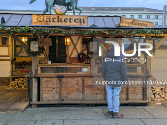 Visitors experience the festive atmosphere of the Medieval Christmas Market in Munich, Bavaria, Germany, on December 6, 2024. The market, lo...