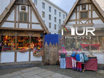 Visitors experience the festive atmosphere of the Medieval Christmas Market in Munich, Bavaria, Germany, on December 6, 2024. The market, lo...