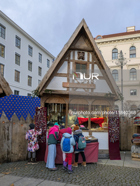 Visitors experience the festive atmosphere of the Medieval Christmas Market in Munich, Bavaria, Germany, on December 6, 2024. The market, lo...