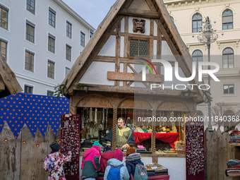 Visitors experience the festive atmosphere of the Medieval Christmas Market in Munich, Bavaria, Germany, on December 6, 2024. The market, lo...