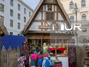 Visitors experience the festive atmosphere of the Medieval Christmas Market in Munich, Bavaria, Germany, on December 6, 2024. The market, lo...