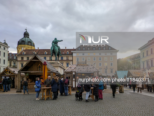 Visitors experience the festive atmosphere of the Medieval Christmas Market in Munich, Bavaria, Germany, on December 6, 2024. The market, lo...