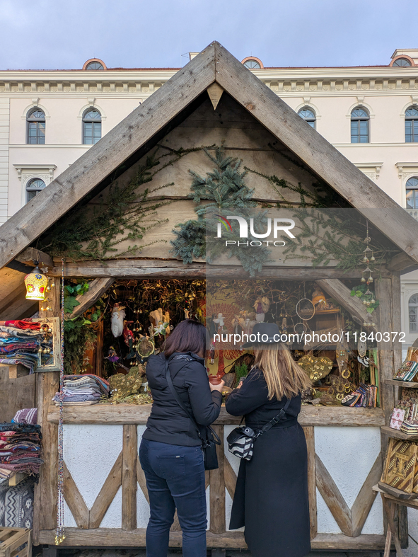 Visitors experience the festive atmosphere of the Medieval Christmas Market in Munich, Bavaria, Germany, on December 6, 2024. The market, lo...