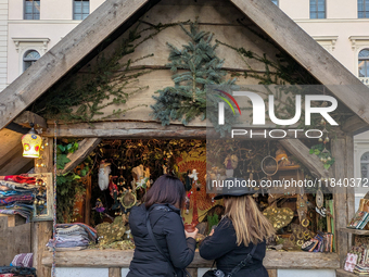 Visitors experience the festive atmosphere of the Medieval Christmas Market in Munich, Bavaria, Germany, on December 6, 2024. The market, lo...