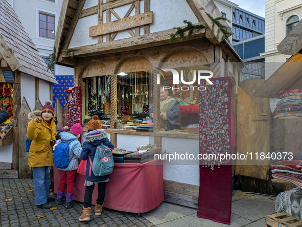 Visitors experience the festive atmosphere of the Medieval Christmas Market in Munich, Bavaria, Germany, on December 6, 2024. The market, lo...