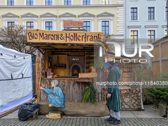 Visitors experience the festive atmosphere of the Medieval Christmas Market in Munich, Bavaria, Germany, on December 6, 2024. The market, lo...