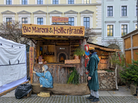 Visitors experience the festive atmosphere of the Medieval Christmas Market in Munich, Bavaria, Germany, on December 6, 2024. The market, lo...