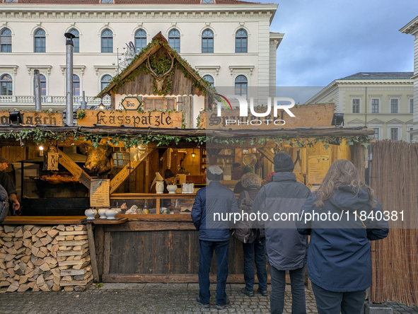 Visitors experience the festive atmosphere of the Medieval Christmas Market in Munich, Bavaria, Germany, on December 6, 2024. The market, lo...