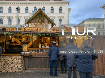 Visitors experience the festive atmosphere of the Medieval Christmas Market in Munich, Bavaria, Germany, on December 6, 2024. The market, lo...