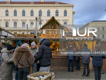 Visitors experience the festive atmosphere of the Medieval Christmas Market in Munich, Bavaria, Germany, on December 6, 2024. The market, lo...