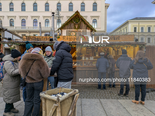 Visitors experience the festive atmosphere of the Medieval Christmas Market in Munich, Bavaria, Germany, on December 6, 2024. The market, lo...