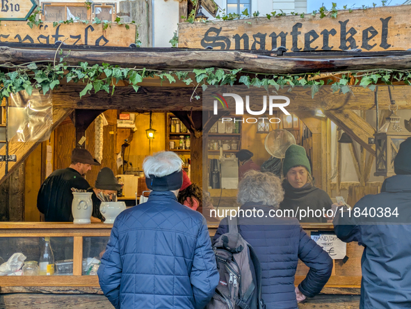 Visitors experience the festive atmosphere of the Medieval Christmas Market in Munich, Bavaria, Germany, on December 6, 2024. The market, lo...