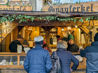 Visitors experience the festive atmosphere of the Medieval Christmas Market in Munich, Bavaria, Germany, on December 6, 2024. The market, lo...