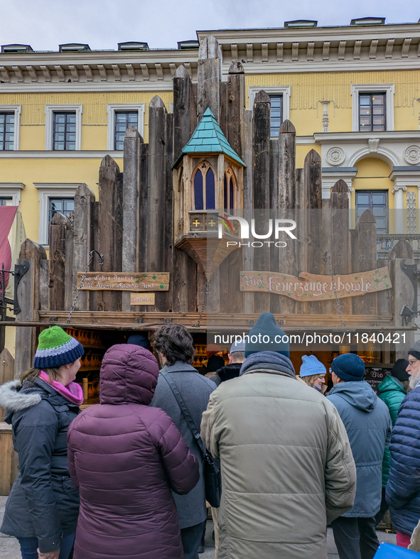 Visitors experience the festive atmosphere of the Medieval Christmas Market in Munich, Bavaria, Germany, on December 6, 2024. The market, lo...