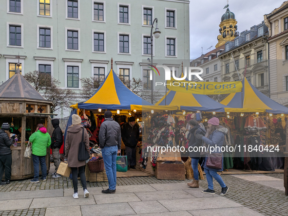 Visitors experience the festive atmosphere of the Medieval Christmas Market in Munich, Bavaria, Germany, on December 6, 2024. The market, lo...