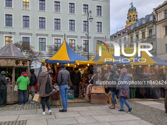 Visitors experience the festive atmosphere of the Medieval Christmas Market in Munich, Bavaria, Germany, on December 6, 2024. The market, lo...