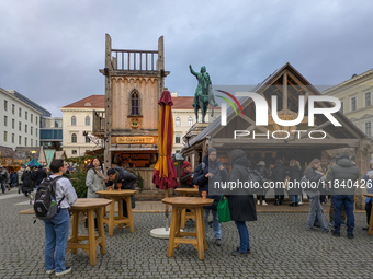 Visitors experience the festive atmosphere of the Medieval Christmas Market in Munich, Bavaria, Germany, on December 6, 2024. The market, lo...