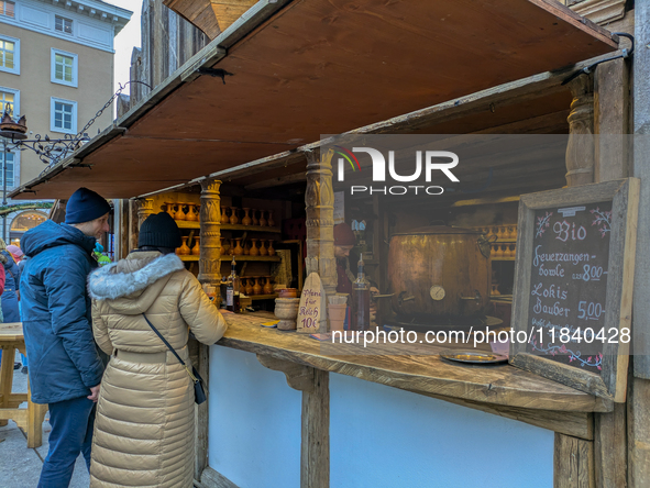 Visitors experience the festive atmosphere of the Medieval Christmas Market in Munich, Bavaria, Germany, on December 6, 2024. The market, lo...