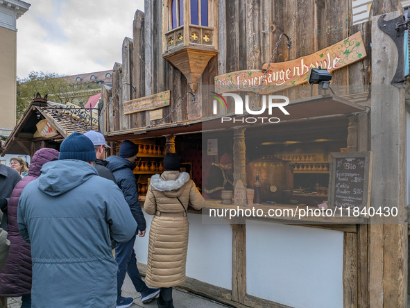 Visitors experience the festive atmosphere of the Medieval Christmas Market in Munich, Bavaria, Germany, on December 6, 2024. The market, lo...