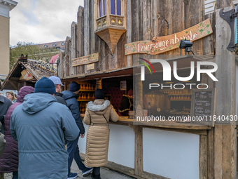 Visitors experience the festive atmosphere of the Medieval Christmas Market in Munich, Bavaria, Germany, on December 6, 2024. The market, lo...