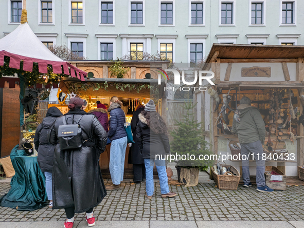 Visitors experience the festive atmosphere of the Medieval Christmas Market in Munich, Bavaria, Germany, on December 6, 2024. The market, lo...