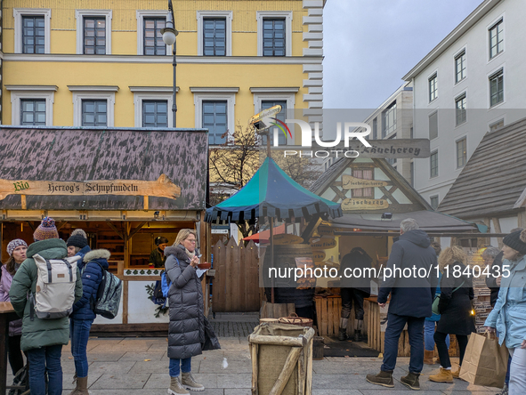 Visitors experience the festive atmosphere of the Medieval Christmas Market in Munich, Bavaria, Germany, on December 6, 2024. The market, lo...