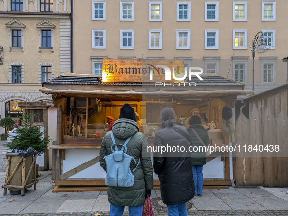 Visitors experience the festive atmosphere of the Medieval Christmas Market in Munich, Bavaria, Germany, on December 6, 2024. The market, lo...