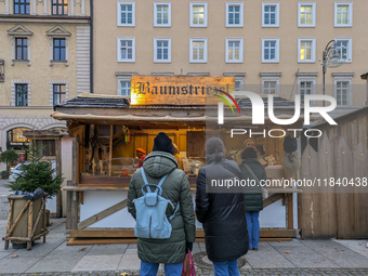 Visitors experience the festive atmosphere of the Medieval Christmas Market in Munich, Bavaria, Germany, on December 6, 2024. The market, lo...