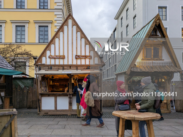 Visitors experience the festive atmosphere of the Medieval Christmas Market in Munich, Bavaria, Germany, on December 6, 2024. The market, lo...