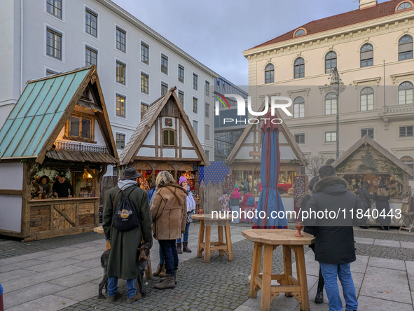 Visitors experience the festive atmosphere of the Medieval Christmas Market in Munich, Bavaria, Germany, on December 6, 2024. The market, lo...