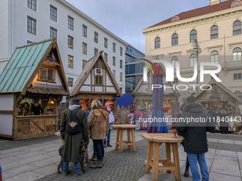 Visitors experience the festive atmosphere of the Medieval Christmas Market in Munich, Bavaria, Germany, on December 6, 2024. The market, lo...